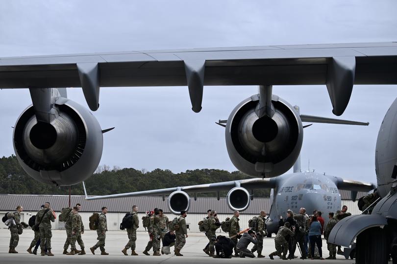 U.S. Army soldiers deploying to Eastern Europe in response to escalating tension with Russia and Ukraine prepare to depart from Fort Bragg, N.C., Feb. 3, 2022. 