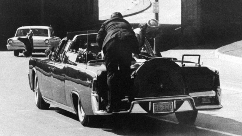 Clint Hill pushed Jacqueline Kennedy back to her seat and shielded her after the shooting.