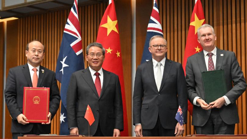 China’s Ambassador to Australia Xiao Qian, China’s Premier Li Qiang, Anthony Albanese abd Tony Burke at a signing ceremony at Parliament House last year.  