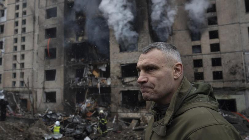 Kyiv Mayor Vitali Klitschko inspects the damage near a building damaged by a Russian rocket attack. (AP PHOTO)