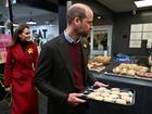 Prince William, Prince of Wales and Catherine, Princess of Wales distribute to Welsh Cakes during a visit to Pontypridd