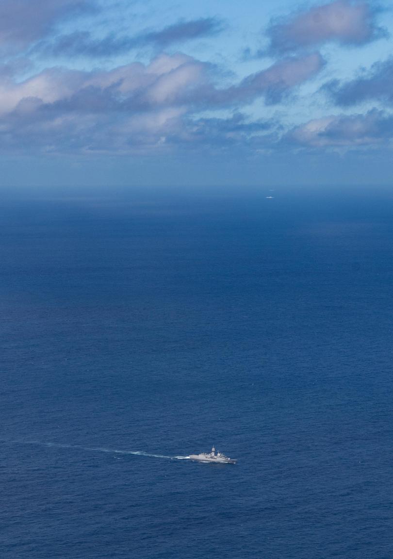 HMAS Stuart (bottom) with People's Liberation Army-Navy (PLA-N) Renhai-class cruiser Zunyi and Fuchi-class replenishment vessel Weishanhu in the Tasman Sea.