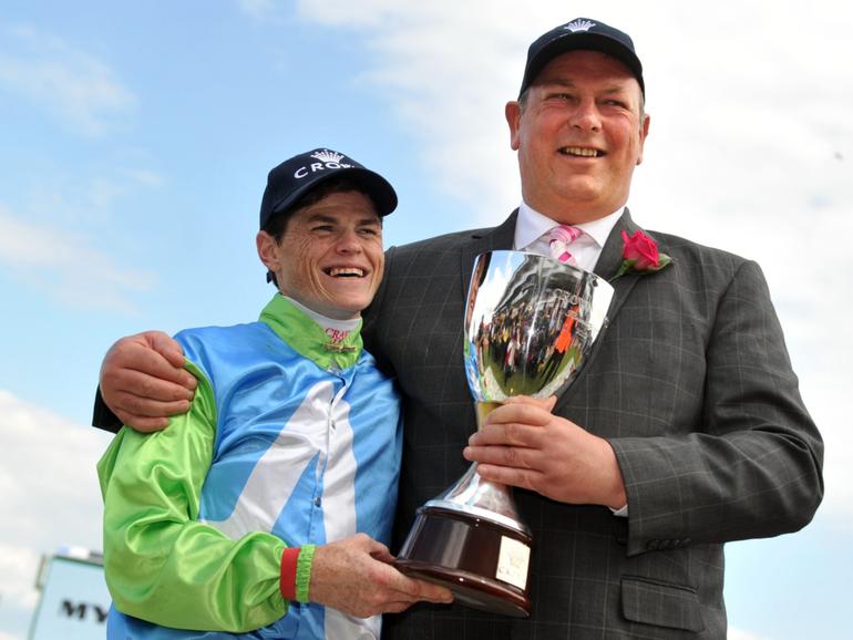 Jockey Craig Williams (left) and trainer Mike Moroney celebrate the victory of Brazilian Pulse in the Crown Oaks at Flemington.