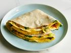 FILE — A scallion egg wrap in New York, Aug. 24, 2018. A Chinese American adaptation of jian bing, a breakfast dish served throughout Northern China and Taiwan, this Genevieve Ko recipe swaps the traditional thin pancake for flour tortillas. Food styled by Barrett Washburne. Props styled by Maeve Sheridan. (David Malosh/The New York Times)