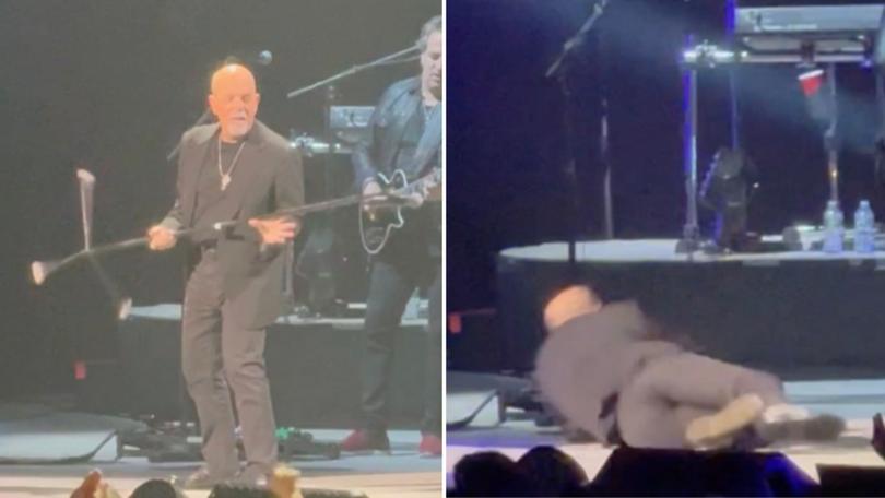 Billy Joel had just thrown the microphone stand before he stumbled backwards and fell.