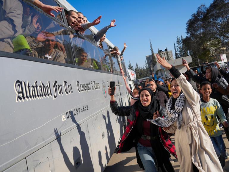 Freed Palestinian detainees are greeted after being released from an Israeli prison.