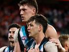 Jordon Sweet (left) and Zak Butters after their preliminary final loss to Sydney last year.