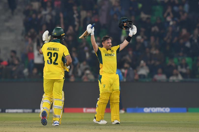 Josh Inglis celebrates his century during the ICC Champions Trophy match between Australia and England.