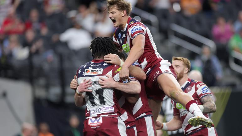 Sam Walters jumps onto Harry Smith after he scored against the Warrington Wolves.