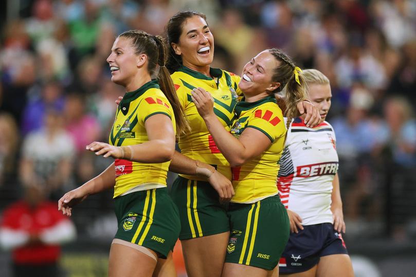 Keilee Joseph celebrates with Olivia Kernick after scoring a try.