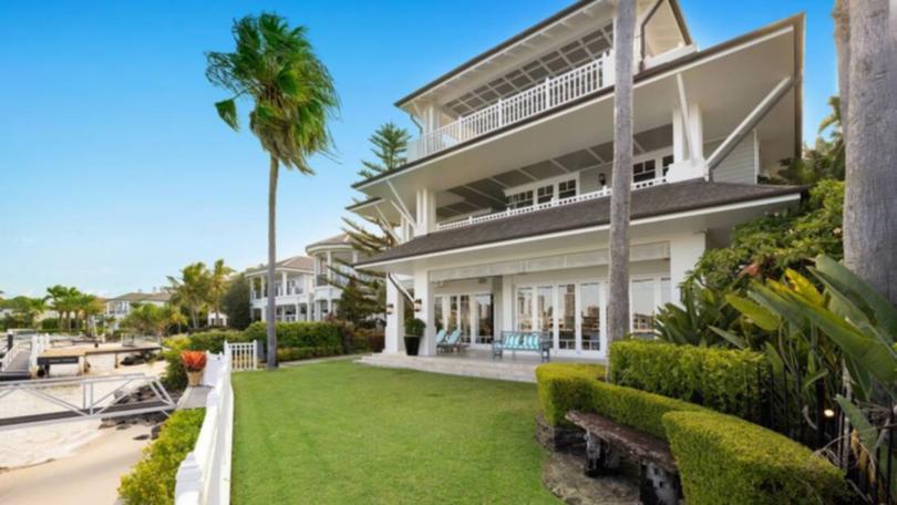 The waterfront home in the Gold Coast suburb of Southport was owned by former Gold Coast Suns and V8 Supercar boss Tony Cochrane and his wife.