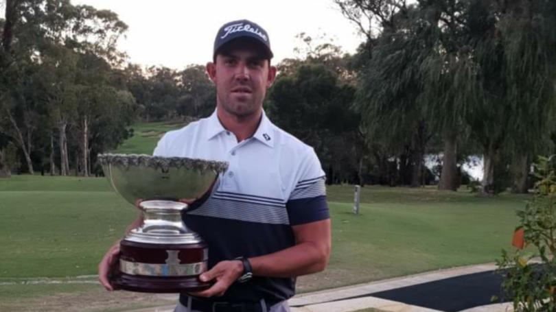 Ryan Peake with one of his many golf trophies.