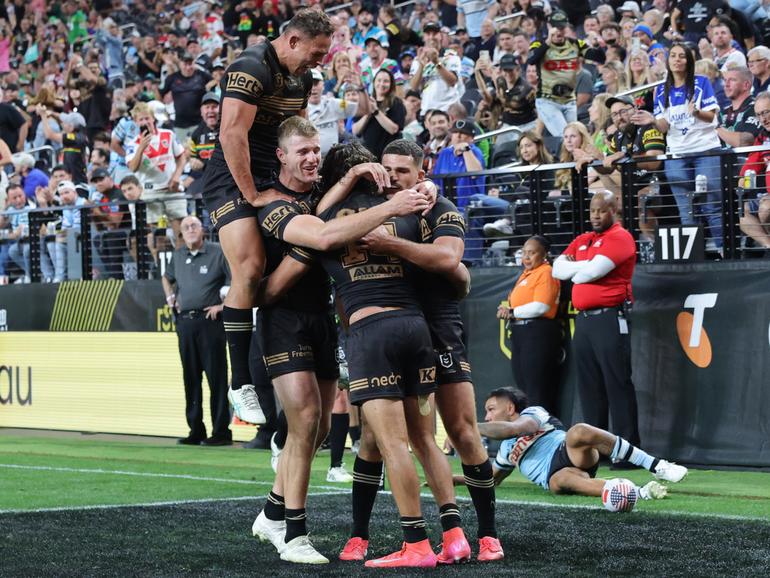 Daine Laurie celebrates  his match-winning try with his Panthers teammates. in Las Vegas.