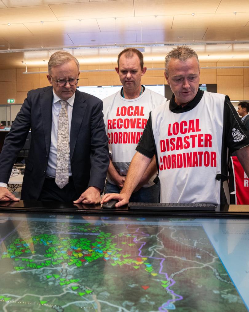 Prime Minister Anthony Albanese in Queensland thanking the defence force, workers and volunteers cleaning up from intense storms.