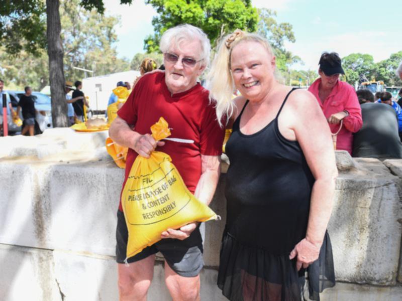 Pierre D'Aubbonnett and Roxanne Zolin will leave their Bribie Island home before a cyclone arrives. (Jono Searle/AAP PHOTOS)