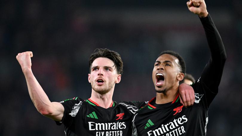 Arsenal’s Declan Rice celebrates victory with teammate Gabriel.