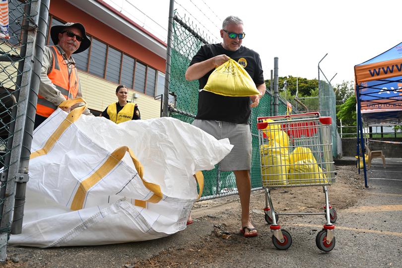 Residents collect sandbags at a Newmarket depot on March 05, 2025 in Brisbane, Australia. 