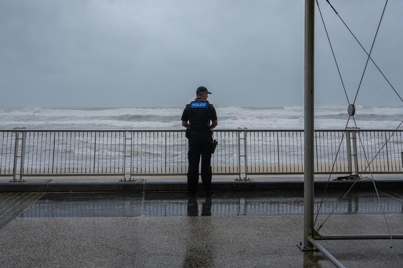 A police officer on patrol looks out to the sea on March 06, 2025 at Surfers paradise in the Gold Coast, Australia. 