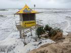 GOLD COAST: A lifeguard post and a collapsed tree on the eroded beach shore at the Southport spit.