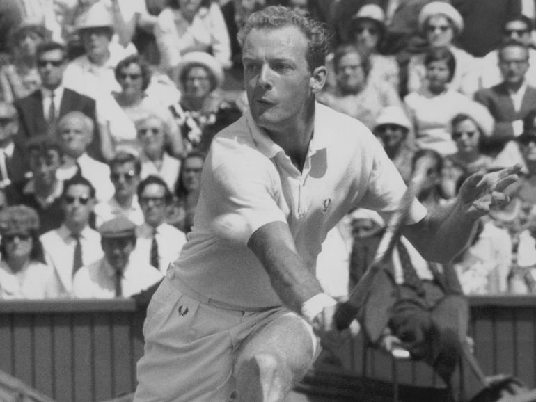 Fred Stolle playing at Wimbledon in 1964. He has died aged 86.