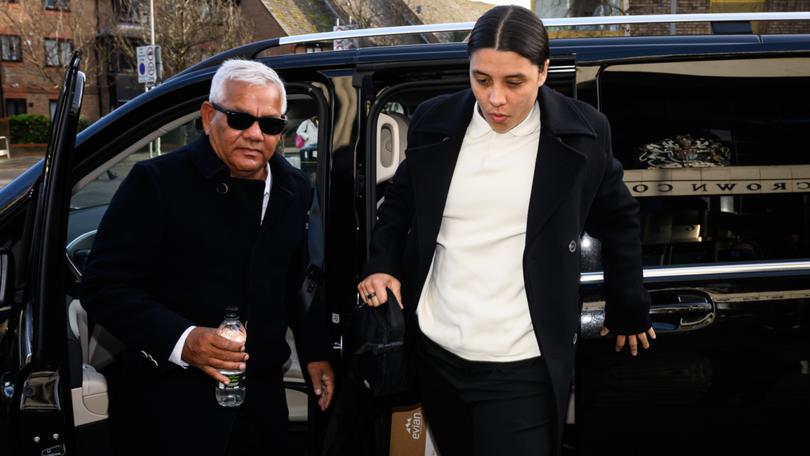 Sam Kerr arrives at a London court with her father Roger last month during her racial harassment trial.