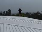 Lance Franklin takes action as the cyclone approaches his Queensland mansion.