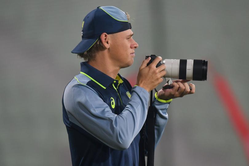 Cooper Connolly,holds the camera during a nets session.