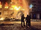 In this photo provided by the Ukrainian Emergency Service, firefighters put out the fire following a Russian rocket attack in Dobropillya, Donetsk region, Ukraine, Saturday, March 8, 2025. (Ukrainian Emergency Service via AP)