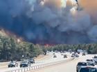 Highways have been closed as authorities race to contain brush fires in New York.