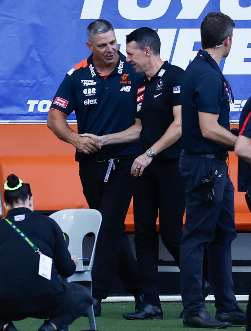 The coaches shaking hands after the game.