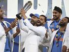 India's Virat Kohli and teammates savour the Champions Trophy after the win over New Zealand.