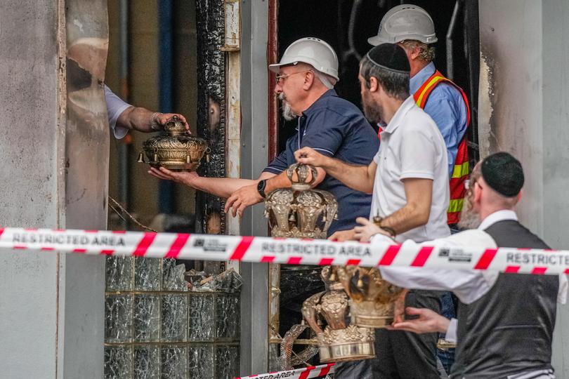 Members of the Synagogue recover items from the Adass Israel Synagogue on December 06, 2024 in Melbourne, Australia. 