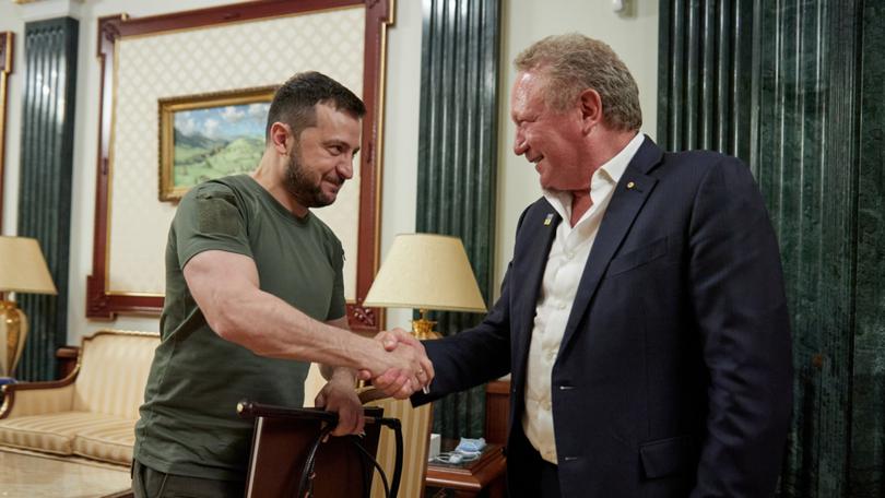 Ukraine President Volodymyr Zelenskiy accepting an R.M. Williams stockwhip from Australian businessman Andrew 'Twiggy' Forrest.