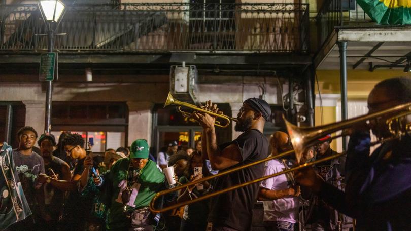 Nathan Scott, centre, and the New Groove Brass Band perform in the French Quarter in New Orleans after the Super Bowl in February. 