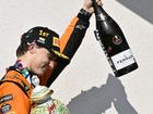 Oscar Piastri celebrates after his maidenHungarian F1 win.. but there was no Champagne shoey! (AP PHOTO)