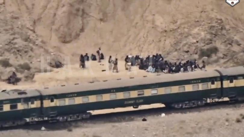 In this frame grab from a video released by the Baluchistan Liberation Army shows people outside the a train after being attacked by the BLA on its transit from Quetta to the northern city of Peshawar, in Bolan district.