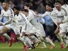 Real Madrid players celebrate their Champions League penalty shootout win over Atletico Madrid. (AP PHOTO)