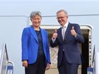 CANBERRA, AUSTRALIA - MAY 23: Prime Minister Anthony Albanese stands with newly appointed Foreign Minister Penny Wong, at the door of their plane on May 23, 2022 in Canberra, Australia. Albanese is travelling to Japan to attend the QUAD Leaders' meeting in Tokyo. Albanese was sworn in as Australia's 31st prime minister on Monday morning following his victory over Scott Morrison in the federal election on Saturday. (Photo by David Gray/Getty Images)