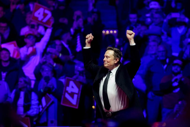 Elon Musk, chief executive officer of Tesla Inc., arrives for a rally with US President-elect Donald Trump.