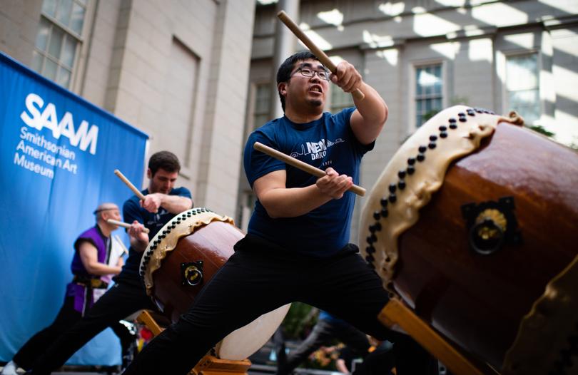 The taiko ensemble Nen Daiko performs in the Kogod Courtyard of the Smithsonian American Art Museum.