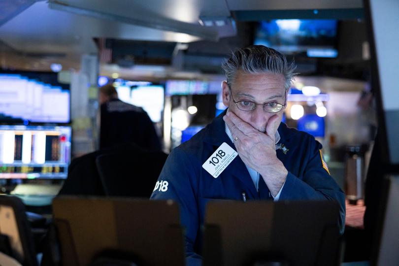 Broker John Romolo feels the pain at the end of the trading day at the New York Stock Exchange after the Dow Jones industrial average lost approximately 537 points.