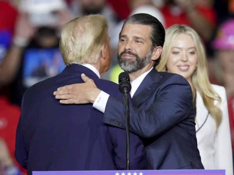 Donald Trump Jr embracing his father President Donald Trump.