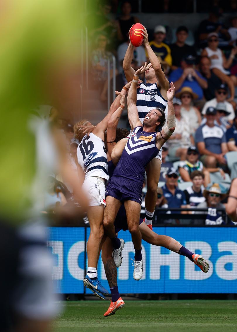 GEELONG, AUSTRALIA - MARCH 15: Shannon Neale of the Cats takes a spectacular mark over Alex Pearce of the Dockers during the 2025 AFL Round 01 match between the Geelong Cats and the Fremantle Dockers at GMHBA Stadium on March 15, 2025 in Geelong, Australia. (Photo by Michael Willson/AFL Photos via Getty Images)