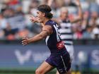 Murphy Reid celebrates kicking a goal.