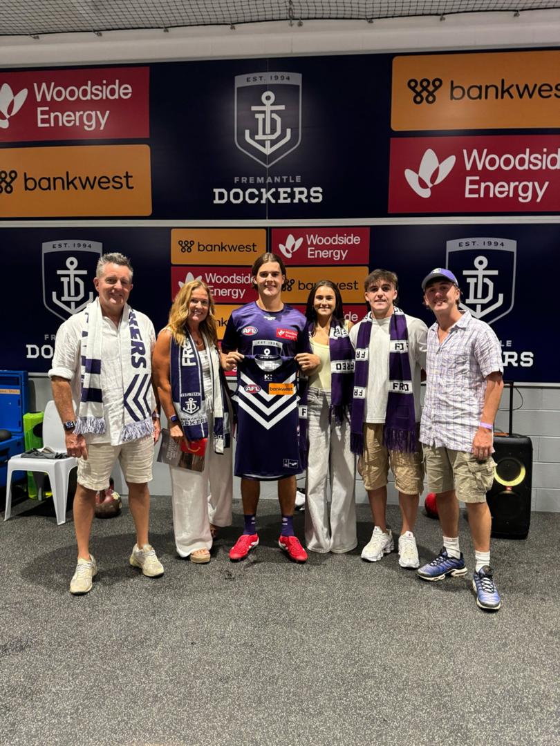 Murphy Reid with his family after his jumper presentation.