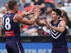 Andrew Brayshaw celebrates kicking a goal.