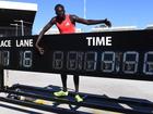 Gout Gout celebrates breaking the 20-second barrier for the first time. (Jono Searle/AAP PHOTOS)