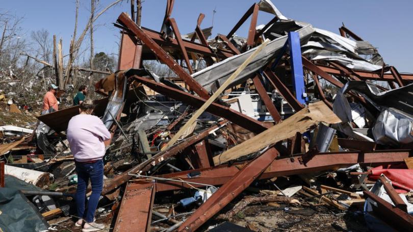 Hundreds of homes have been destroyed as dozens of tornadoes smashed through multiple states. (AP PHOTO)