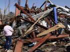 Hundreds of homes have been destroyed as dozens of tornadoes smashed through multiple states. (AP PHOTO)