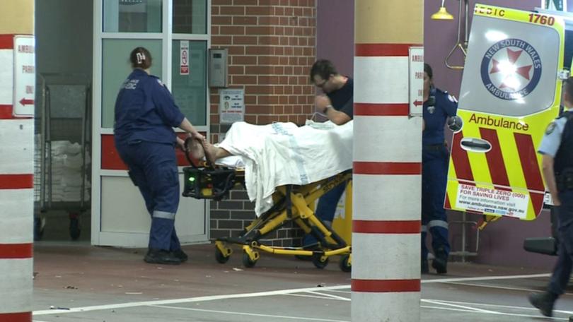 A man allegedly found wearing a balaclava has been hospitalised with a stab wounds.